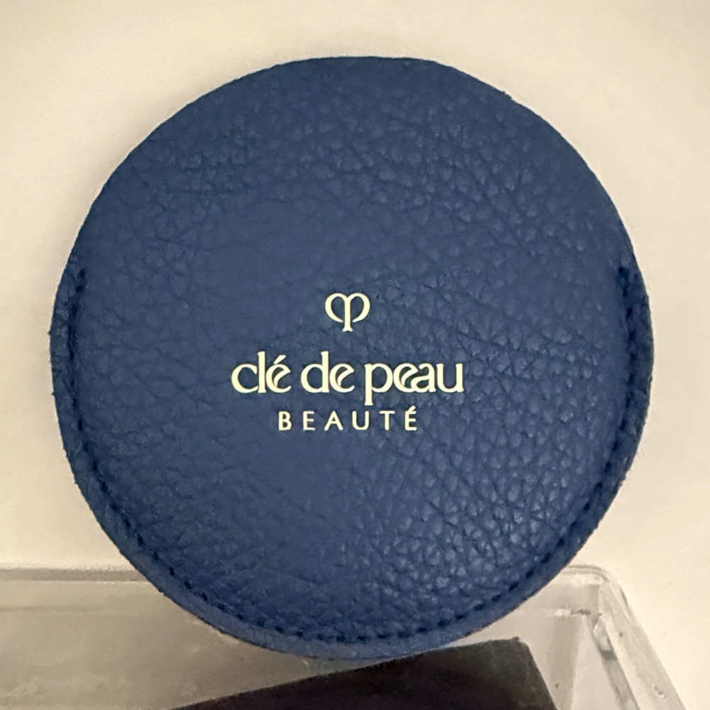 cle de peau Navy Blue Compact with Gold Emblem